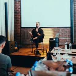 photo of man holding mic
