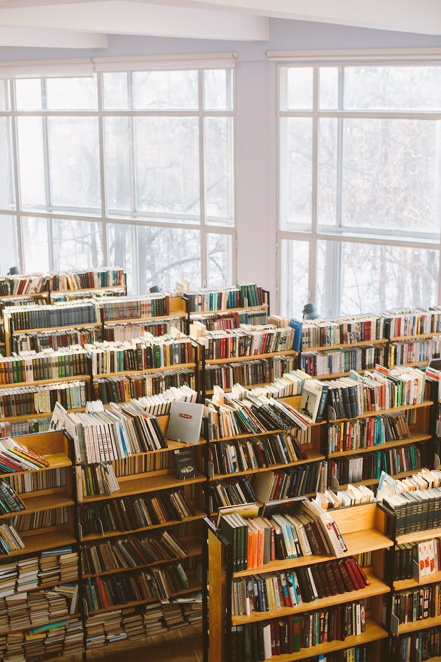 books on brown wooden shelf