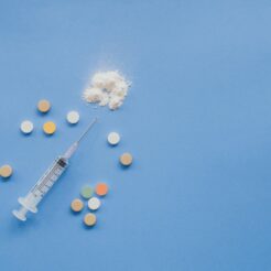 top view of syringe with pills